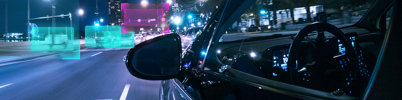 banner image of a technology assisted car driving on a street