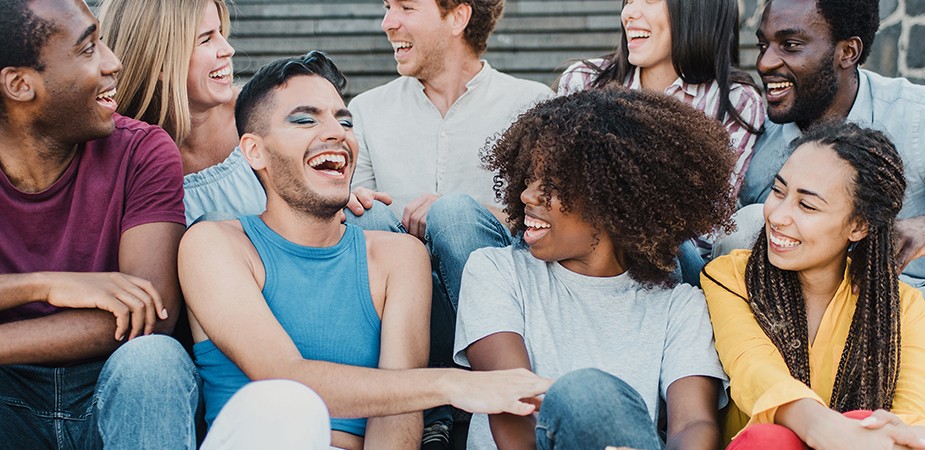 group of people talking and smiling at each other