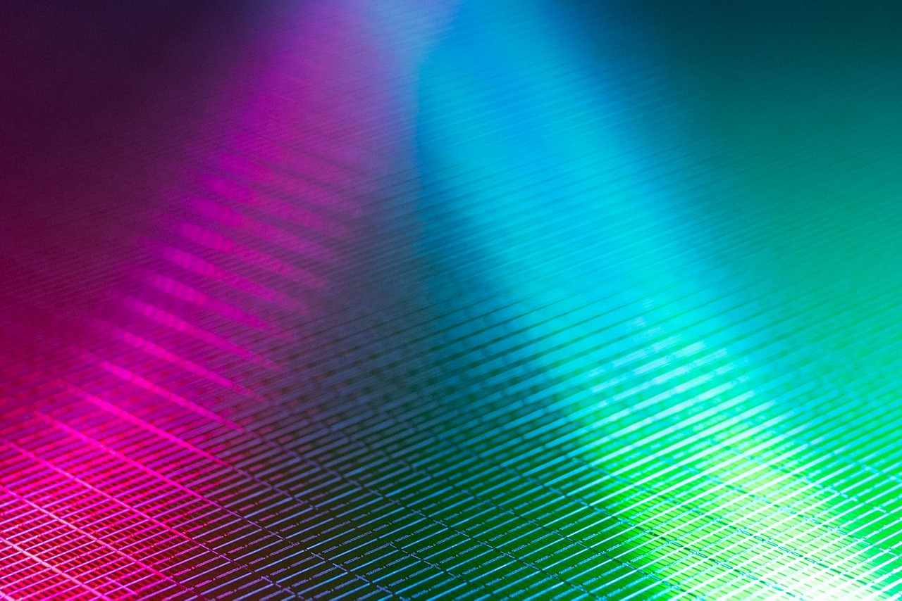 pink and blue lines pointing into the black background