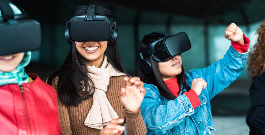 three women using virtual reality heads together