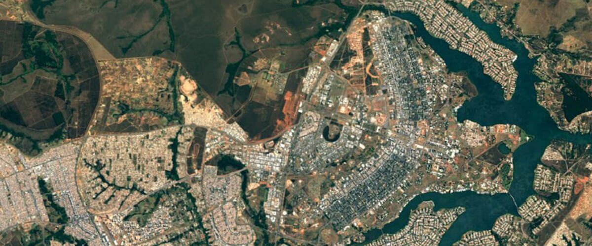 arial view of city between water and land