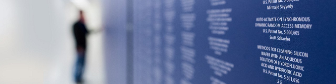 blurred picture of a person looking at a wall of awards