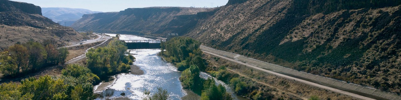 River flowing beside a mountain