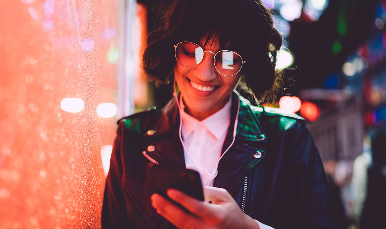 Young woman looking at her phone